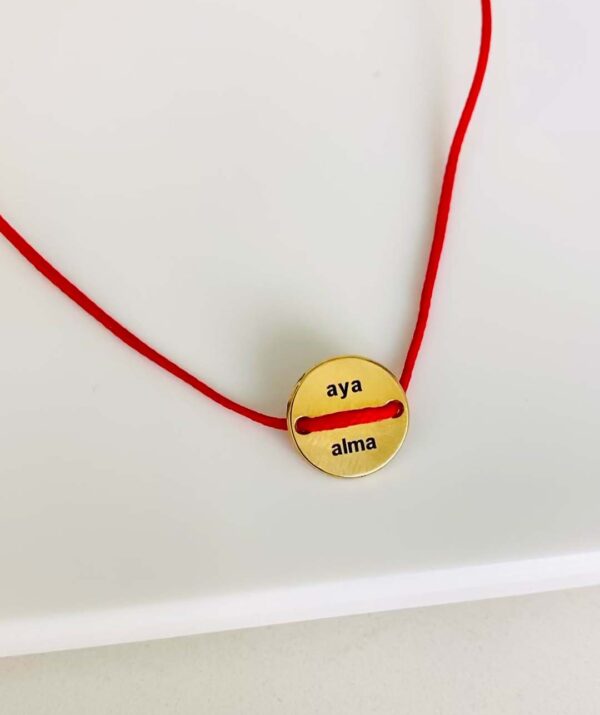 button red rope bracelet  / yellow gold plaiting on silver